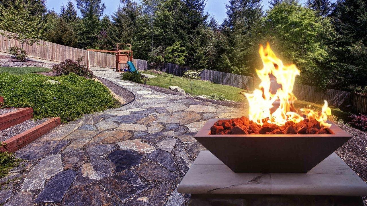 Fire feature in backyard of home