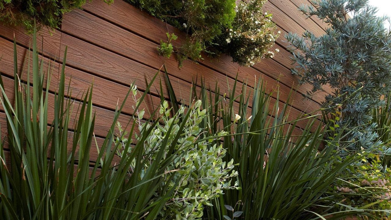 vertical garden using trex decking for flower boxes