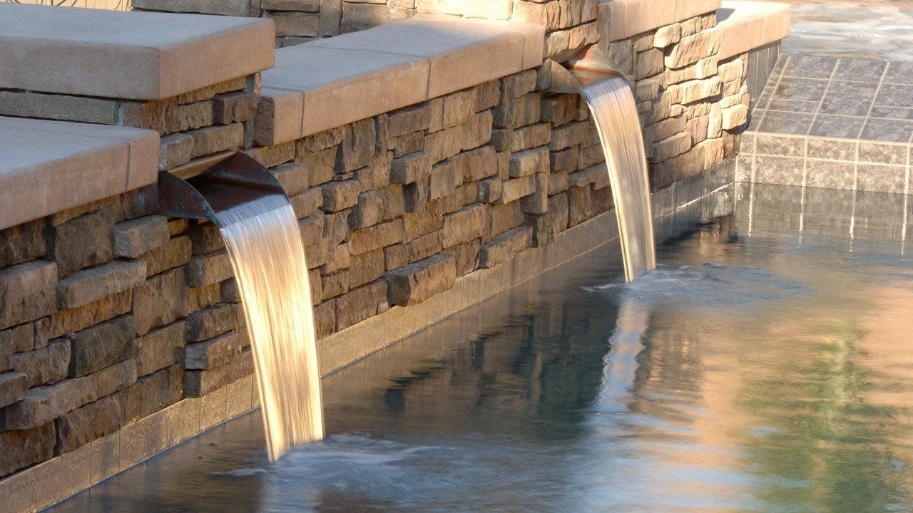stone water feature in backyard